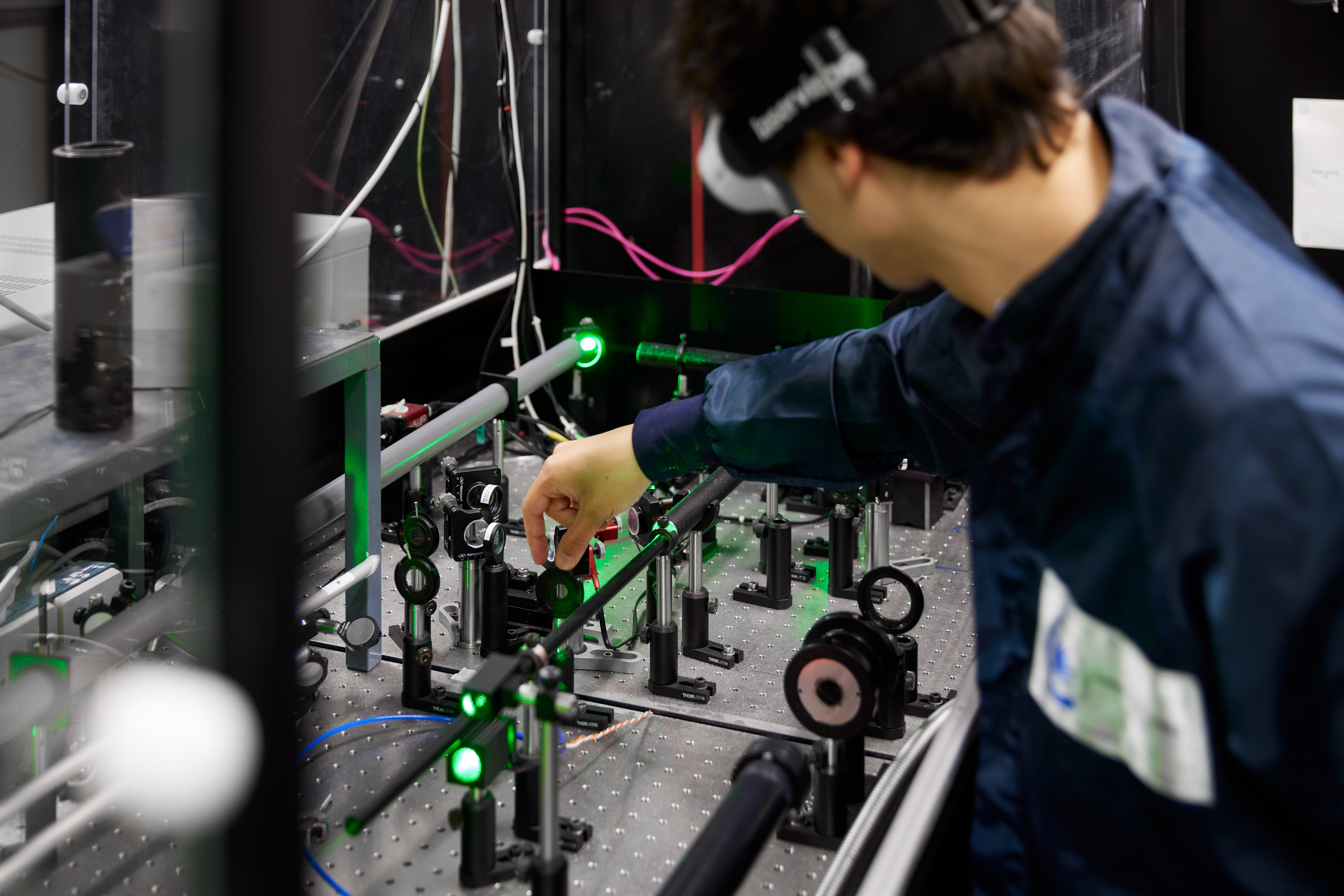 Laser scientist adjusting optics in Gemini laser