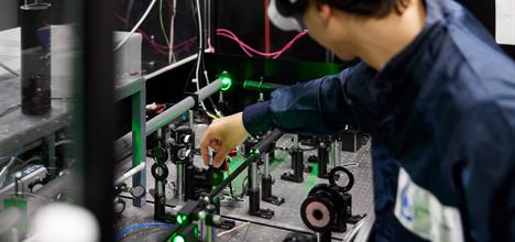 Laser scientist adjusting optics in the Gemini laser