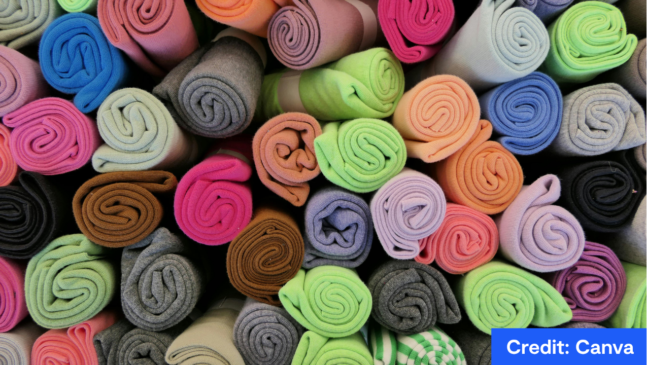 rolls of different colours fabrics. Credit: Canva