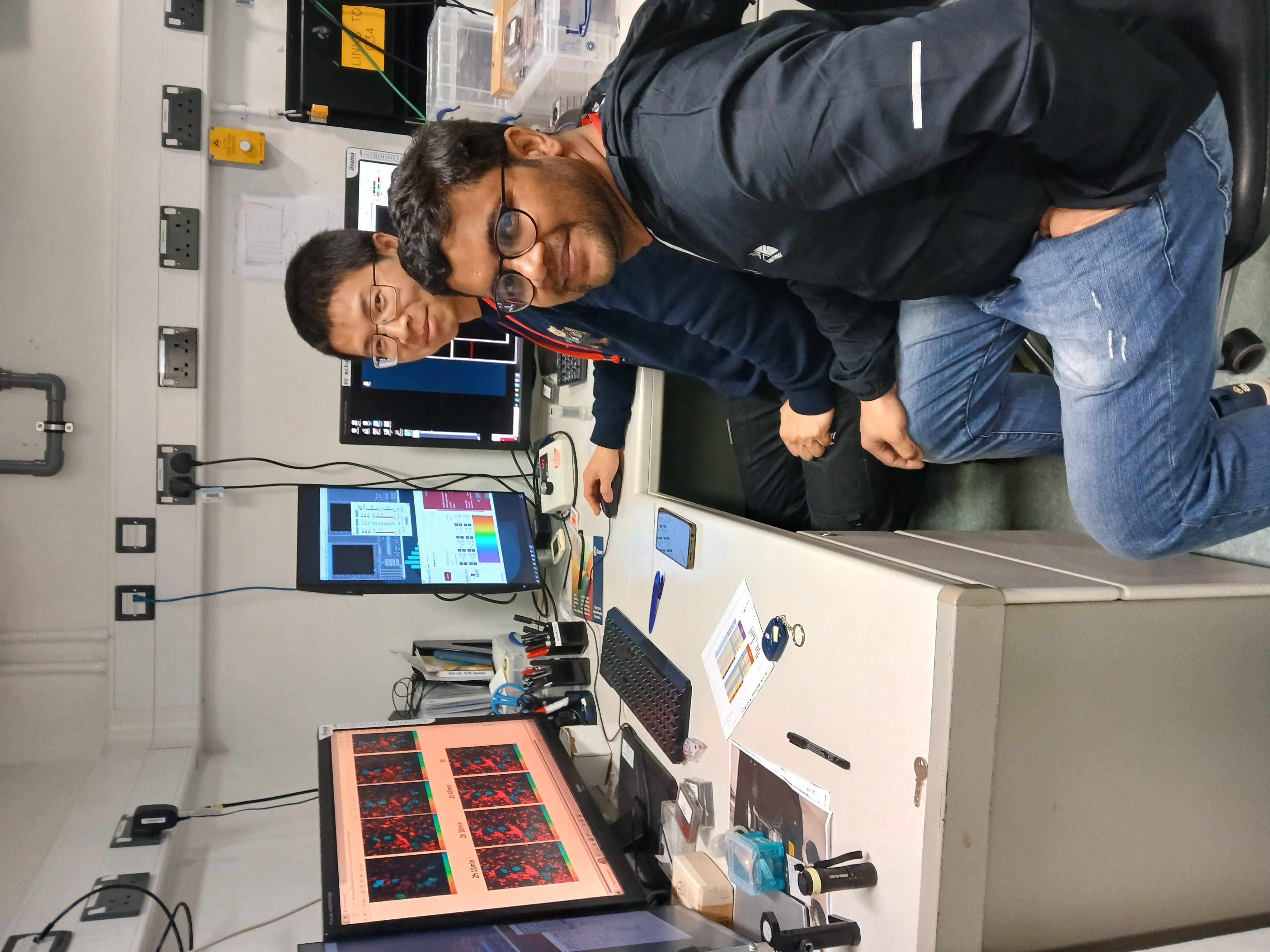 Mukesh and Zengchun working away on the experiment..jpg