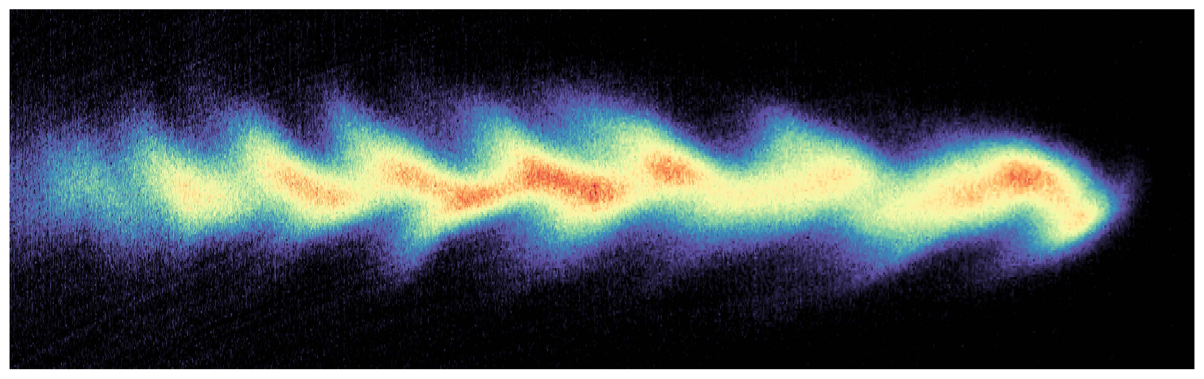 A thin multicoloured wave in a simialr shape to the wake of a boat travels across the image. There is a black background.